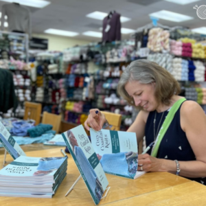 famous author signing books at yarn store