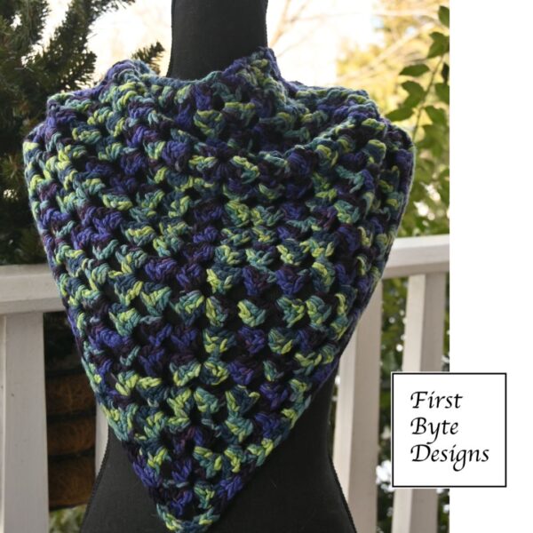 front view shawl with green periwinkle and blue details in the aran weight yarn