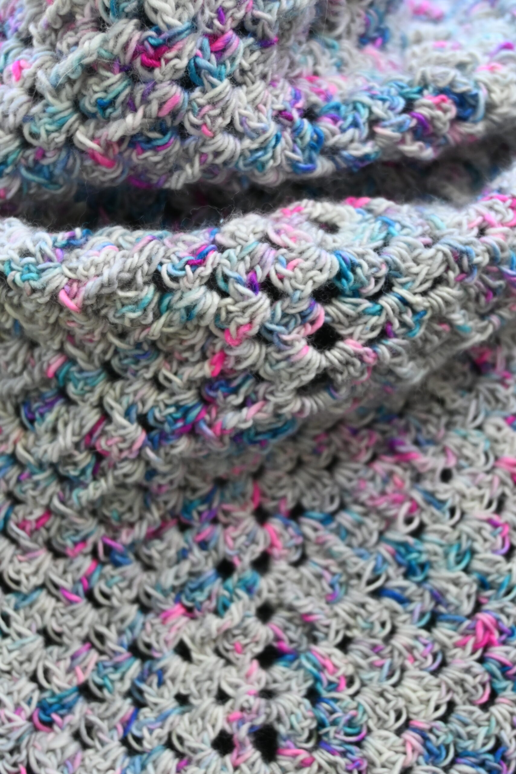 blue pink silver grey crochet stitch on white background